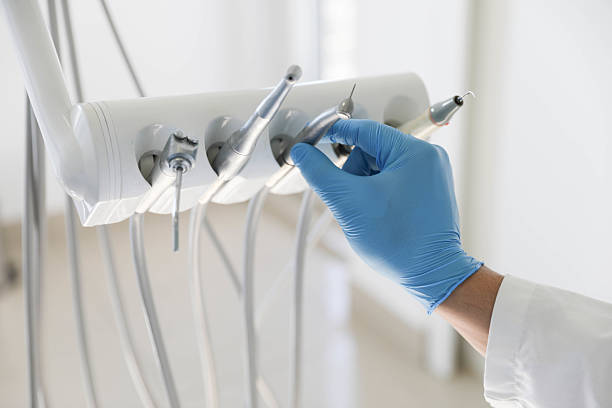 Professional Invisalign Clear Aligners technician working in Lowell, MA